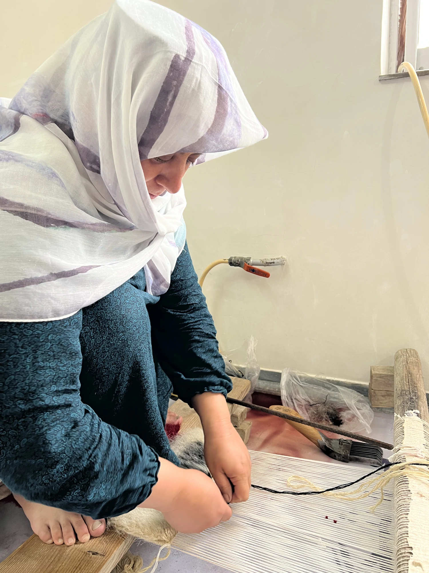 An artisan weaving