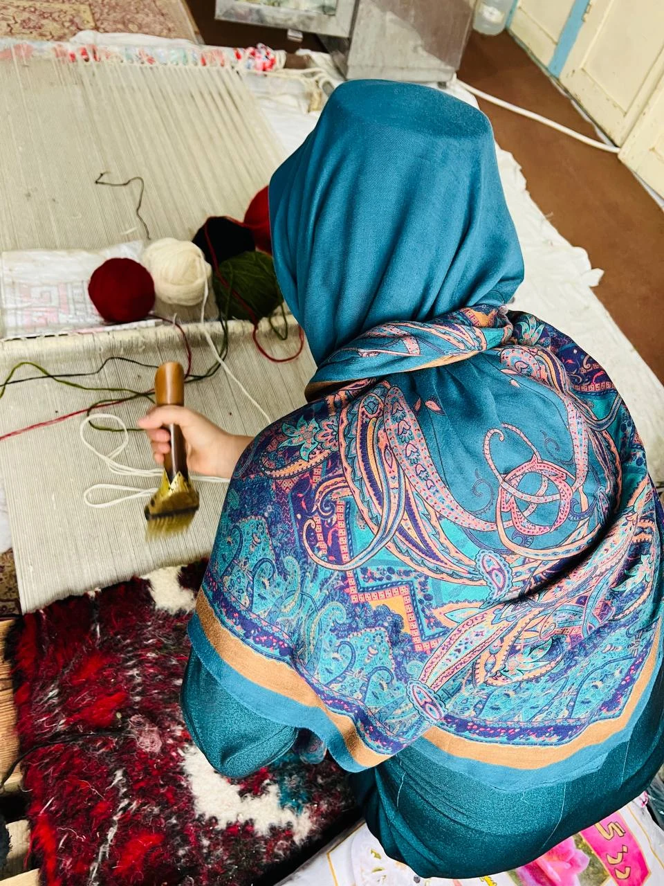 An artisan working at the loom